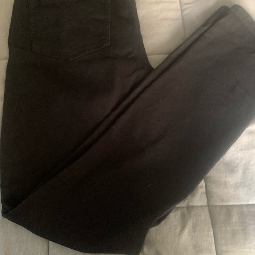 Miley Cyrus black pants